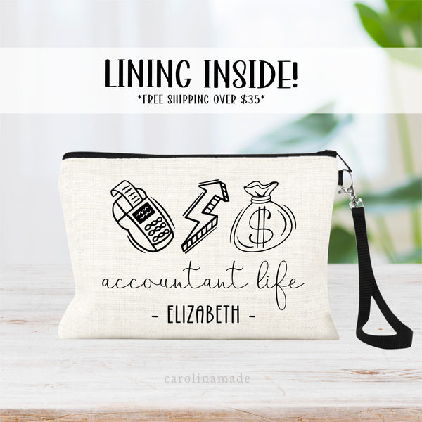 This linen zipper pouch features a minimalist design with a calculator, money graph arrow and bag of money at the top. It says accountant life underneath. And is personalized at the bottom with your name.