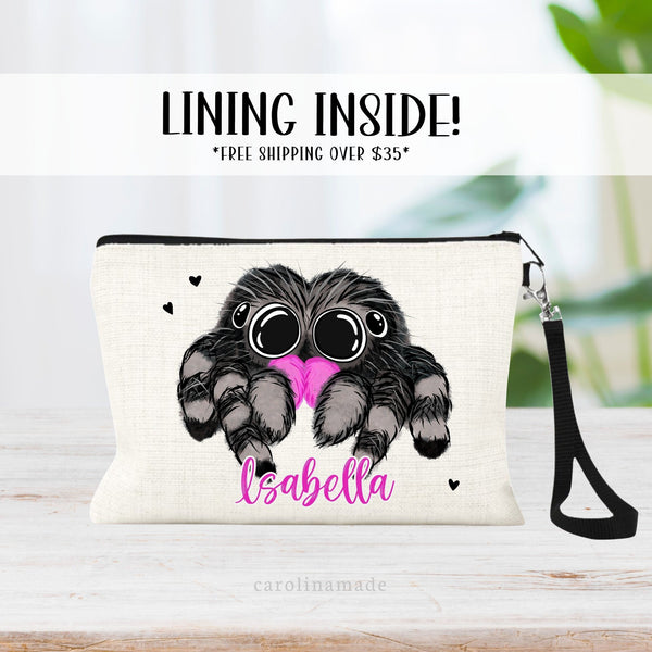 This linen zipper pouch features an adorable black, gray and pink jumping spider. It is personalized at the bottom with your name in pink.