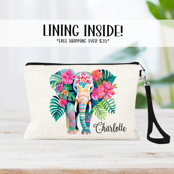 This linen zipper pouch features a pretty tropical floral and greenery design with an elephant in the center. It is personalized in the corner with your name.