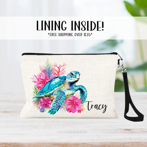 This linen zipper pouch features a pretty tropical floral and coral design with a sea turtle. It is personalized in the corner with your name.