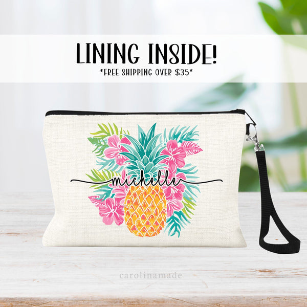 This linen zipper pouch features a pretty tropical floral palm leaf design with a large pineapple. It is personalized with your name centered over the pineapple.