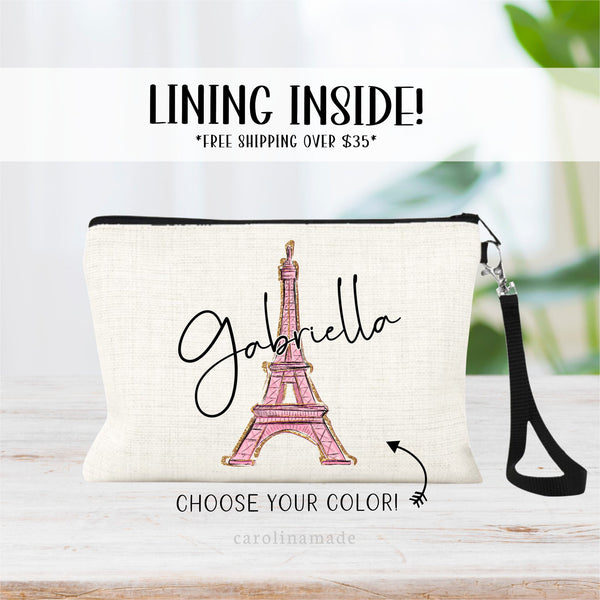 This linen zipper pouch features and Pink and Gold Eiffel Tower in the center with your name personalized across the top of it. Choose from Pink, mint, purple and blue.