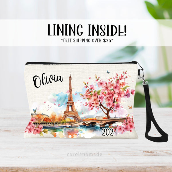 This linen zipper pouch features a beautiful watercolor Paris design with the Eiffel Tower, Bridge, Water and Cherry Blossom Trees. Personalize with your name for your next Paris Trip!