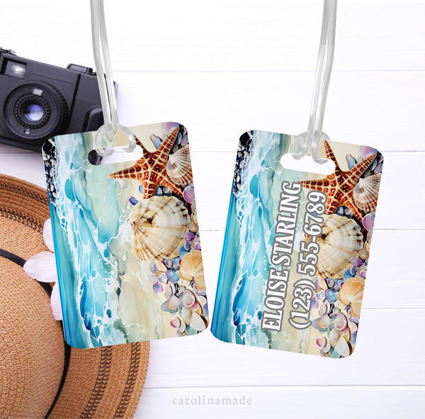 This luggage tag features a colorful beach scene with blue water and lots of seashells. It is personalized on one side with your name and contact information.