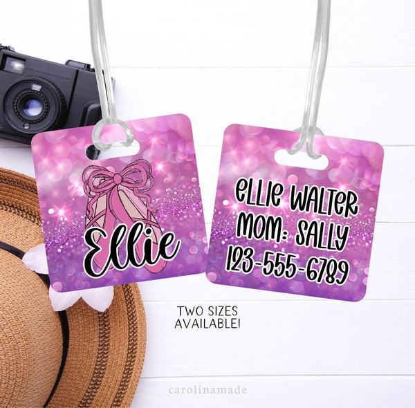 This Bag ID Tag features a pink and purple glitter background with ballerina slippers on the front. The front is personalized with a name. The back has Moms contact information.