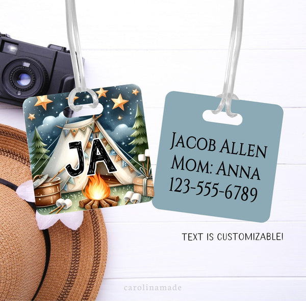 This tag features a cool night time camping scene with a tent, stars, campfire and smores. The front shows the camper's initials. The back has parents contact info.