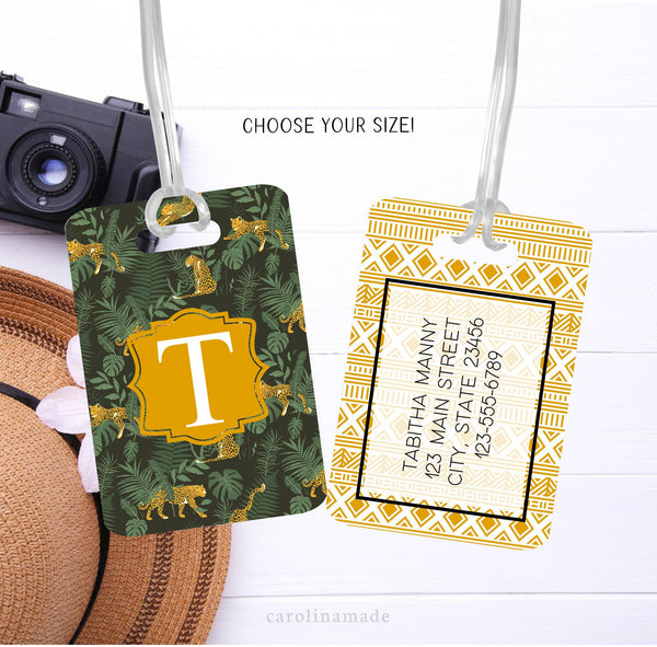 This luggage id tag features a cheetah and palm leaf design on the front with large initial. The bag has matching color geometric Aztec design and is personalized with your contact information.
