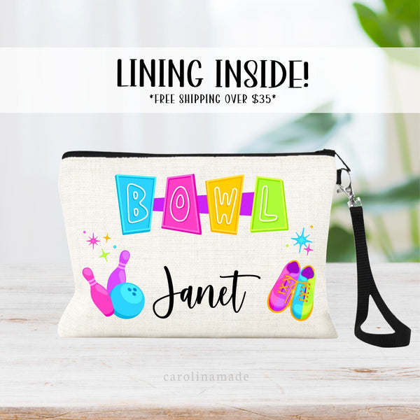 This linen wristlet features a bright colorful neon cosmic bowling design with retro bowl sign at the top, pins, a ball, shoes and star bursts. Your name is personalized at the bottom.