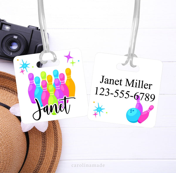 This aluminum bag tag features a bight colorful neon bowling design with pens, ball and star bursts. It is personalized on the front with your name. The back shows your contact information.