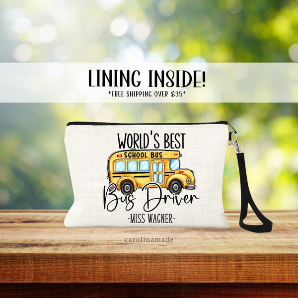 World Best Bus Driver personalized linen wristlet bag with clipart of school bus. Name is at the bottom.