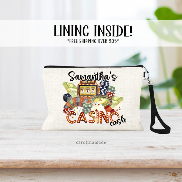 Dont forget your wristlet purse your next casino trip! This bag features casino items combined to one design. And is personalized with your name. persons Casino Cash!  Dice, poker chips, cash, slot machine, roulette and more