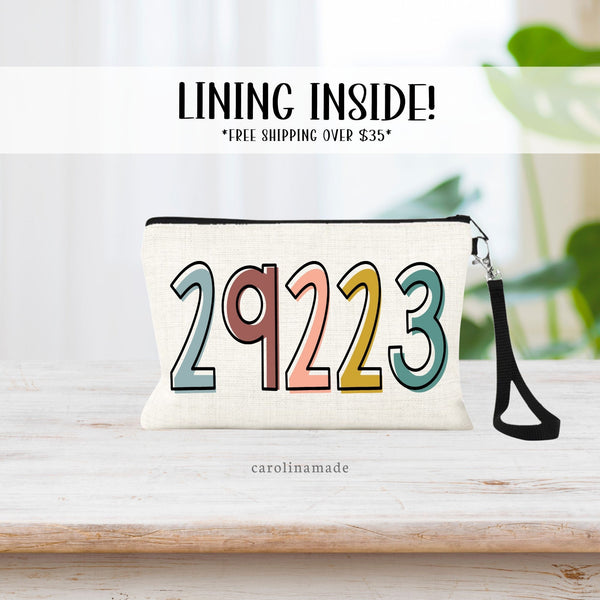 This Makeup Wristlet Bag features your zip code in colorful boho color numbers.