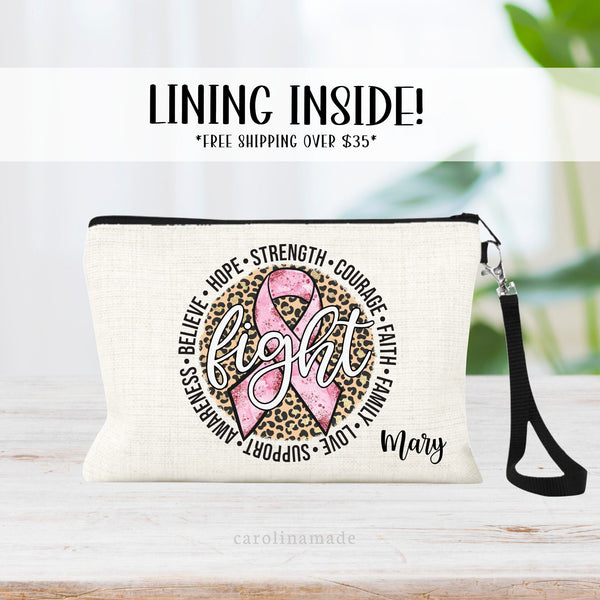Breast Cancer linen zipper pouch with pink ribbon and leopard print background. The word fight is big and center with words in a circle - hope, strength, courage, faith, family, love, support, etc. Personalize with name in the corner.