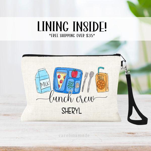 This personalized linen wristlet features a cafeteria lunch crew design with milk, tray and food, and juice. It is personalized at the bottom with your favorite lunch workers name.