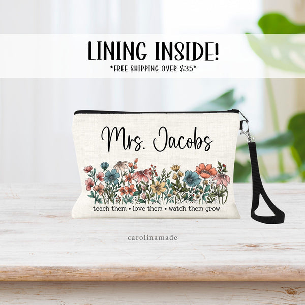 Beautiful linen zipper pouch with floral design that says under the flowers, teach them love them, watch them grow. The top is personalized with your teachers name.
