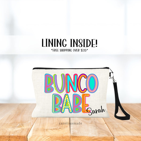 This linen zipper pouch says BUNCO BABE large across the bag in a colorful marquee style font. Your name is personalized in the bottom corner.