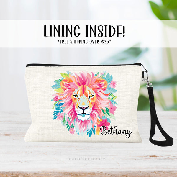 This linen zipper pouch features a pretty tropical floral and greenery design with a lion in the center. It is personalized in the corner with your name.