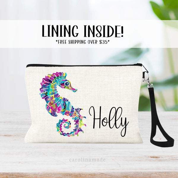 This linen zipper pouch features a pretty floral pattern design with a sea horse. It is personalized in the corner with your name.
