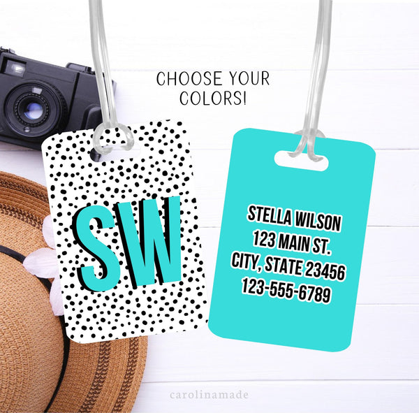 This luggage tag features black and white dalmatian print with large colorful initials on the font. The back is personalized with your contact information.