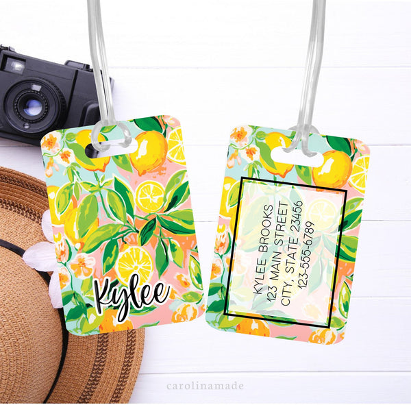 This aluminum luggage tag features a colorful preppy lemon design on both sides. The front has a name. And the back is personalized with contact info.