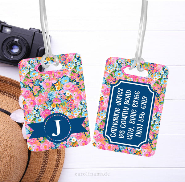 This aluminum luggage tag features a colorful preppy floral design on both sides. The front has a name. And the back is personalized with contact info.
