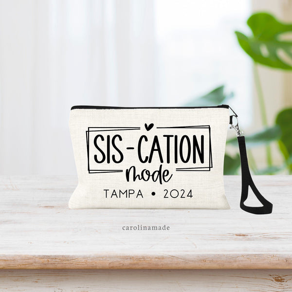 This linen wristlet features the text SIS-CATION mode and is personalized under that with destination, names, date or whatever you want it to say. You choose! Perfect for your next sister getaway!