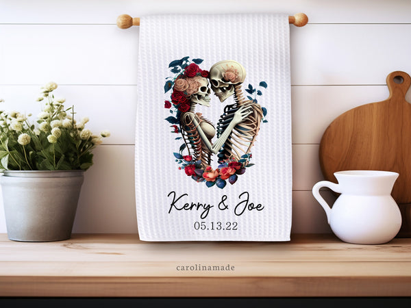 This white waffle weave towel features a skeleton couple. It is personalized with your name and wedding date at the bottom.