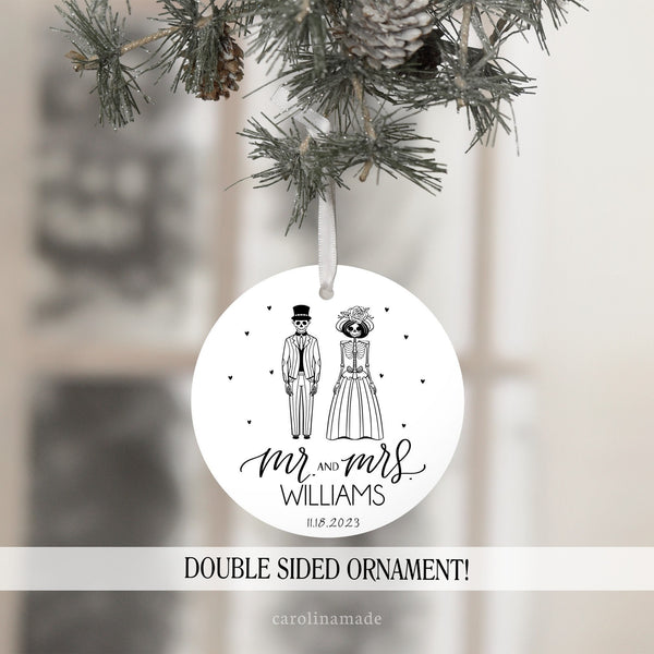 This white ornament features a groom and bride skeleton wedding design that is personalized with mr and mrs name and wedding date.