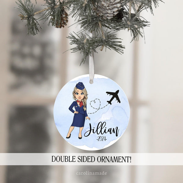 This beautiful Christmas ornament has a blue watercolor sky like background with a personalized flight attendant standing next to a airplane. It is customized with your name and the year.