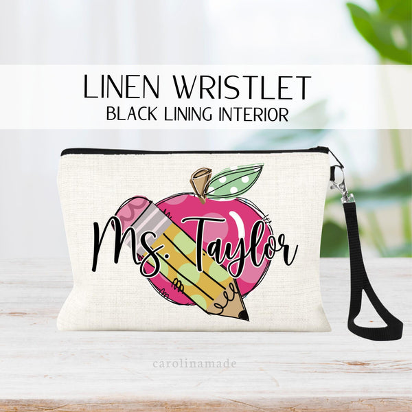 This linen zipper pouch features a big pink apple with a pencil over it and is personalized with your name across the front.
