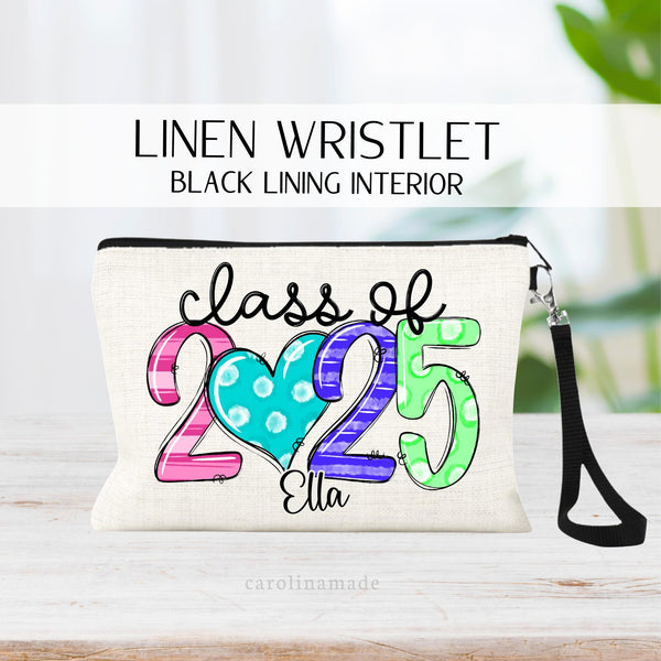 Class of 2025 zippered lined pouch personalized with name under design. 2025 is big colorful numbers with a heart as the zero.