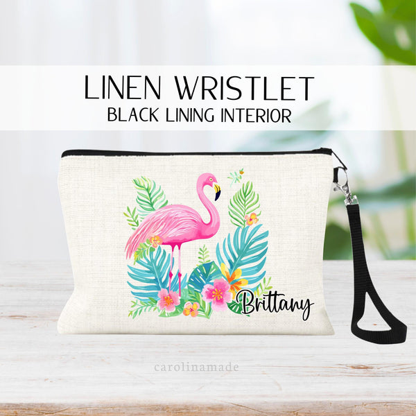 This linen zipper pouch features a pretty tropical floral and greenery, palm leaf design with a flamingo in the center. It is personalized in the corner with your name.