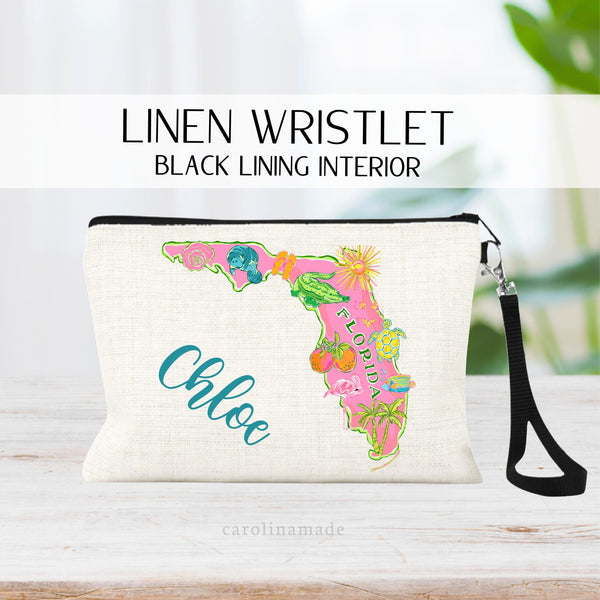 This linen zipper pouch features a fun preppy Florida state design with seashell, manatee, gator, oranges, flamingo, palm tree, sea turtle and fish. Personalize it with your name on the side.