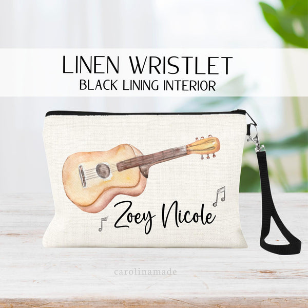 Beautiful watercolor guitar with name personalized at the bottom and music notes surrounding.