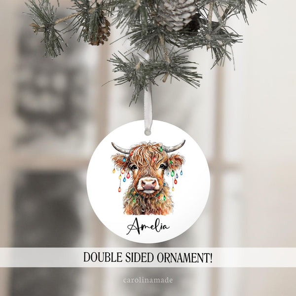 Watercolor Highland cow with Christmas Lights Design. Featuring personalized name at the bottom.