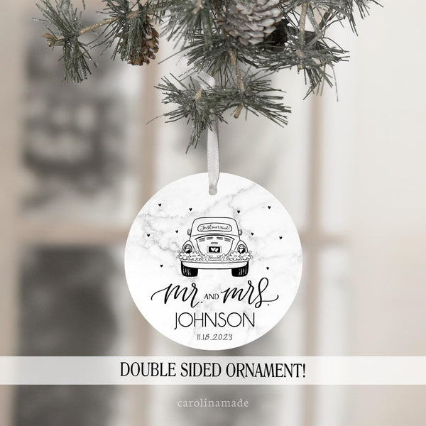 This ornament features a just married car with mr and mrs down at the bottom and is personalized with your last name and wedding date.