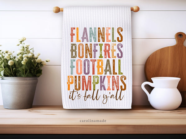 It's fall yall bucket list towel. Text is in colorful letters and distressed font. Flannels, Bonfires, Football, Pumpkins. Perfect fall thanksgiving towel!