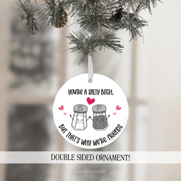 Youre a salty bitch but thats why were friends funny christmas ornament featuring a salt & pepper shaker and pink hearts surrounding it.