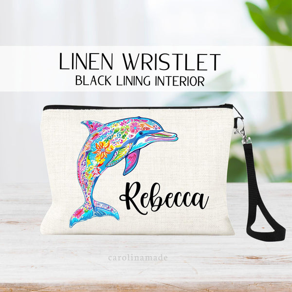 This linen zipper pouch features a pretty floral pattern design with a dolphin. It is personalized in the corner with your name.