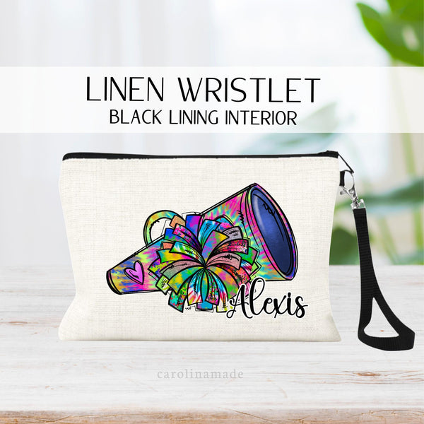 This fun Cheer Makeup Bag features a megaphone and pom pom both in a colorful tie dye pattern. It is personalized with your name at the bottom corner.
