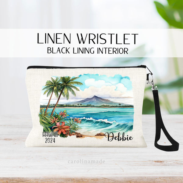 Watercolor Hawaii Beach and Volcano Scene with palm trees and flowers in the center of the wristlet. The bottom says Hawaii and the current year on the left. The right is personalized with your name.