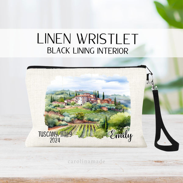 Beautiful watercolor design of Tuscany Italy in the middle of this linen wristlet bag. It is personalized with your name on bottom right, with Tuscany Italy and the year on the bottom left.