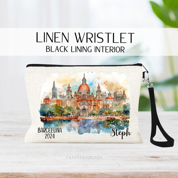 Beautiful watercolor design of Bacelona Spain in the middle of this linen wristlet bag. It is personalized with your name on bottom right, with Barcelona and the year on the bottom left.