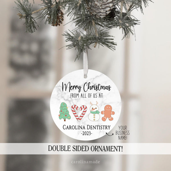 Merry Christmas from all of us at Office Ornament. Perfect gift to show appreciate to office staff and clients and/or patients. Features christmas clip part - tree, candy cane, snowman & gingerbread man. Personalize with your business name.