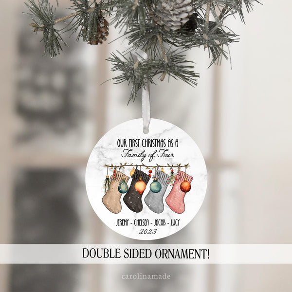 Our First Christmas as a Family of Four personalized ornament. Featuring cute stocking design. And personalized with family members names and the year.