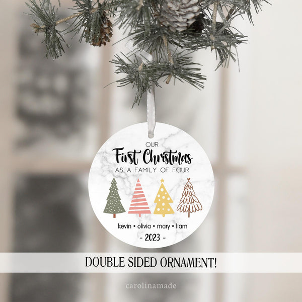 our first christmas as a family of four with a printed marble background, four different boho style christmas trees. and a name is personalized at the bottom under each tree for your four family members. the year is at the bottom.