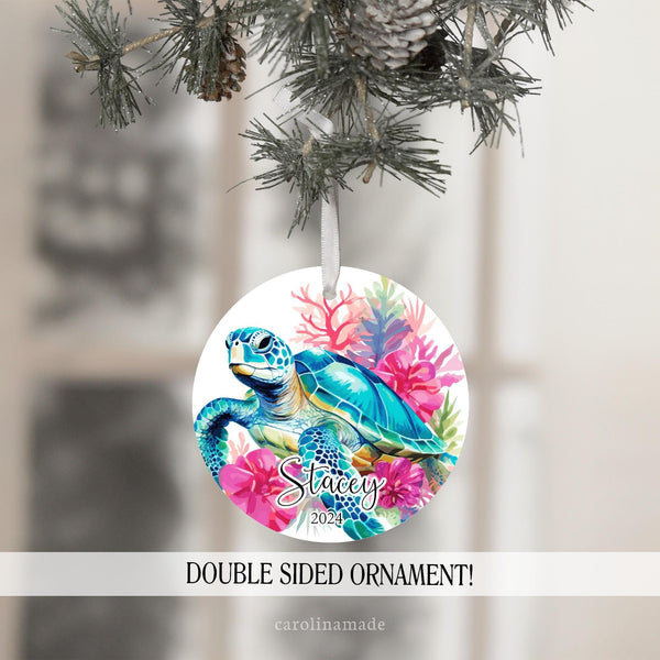 This ornament features bright colorful sea turtle design with flowers and coral. It is personalized at the bottom with your name and the year.