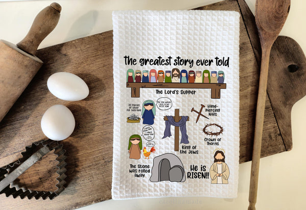 This white waffle weave towel feattures the Christmas Story of Jesus. At the top it says the greatest story ever told. With the Lords supper, silver, hand piercing nails, crown of thorn, Cross, King of the Jews, The stone was rolled away. He is Risen