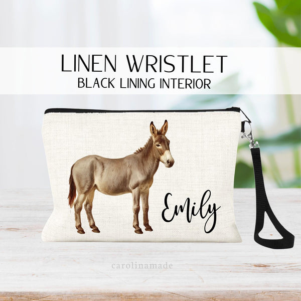 This linen zipper pouch features a brown donkey and is personalized with your name next to it. Perfect for travel, makeup, pens and more!