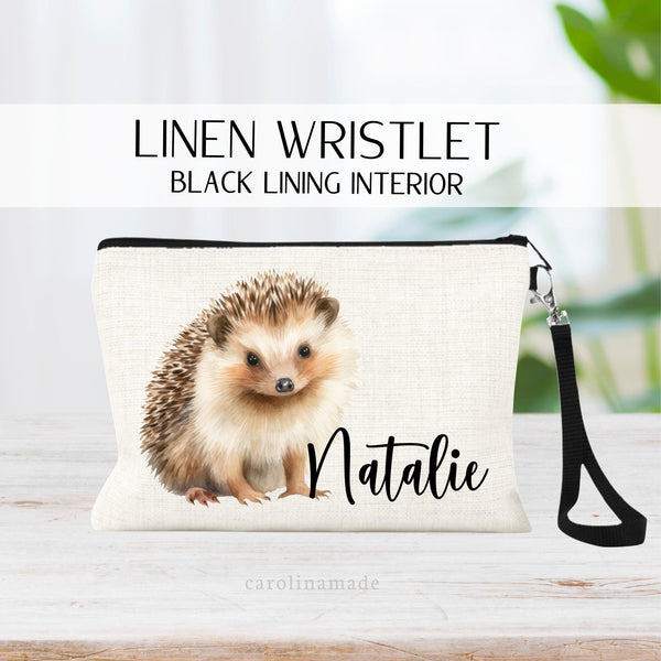This linen zipper pouch features a watercolor hedgehog and is personalized with your name next to it. Perfect for travel, makeup, pens and more!